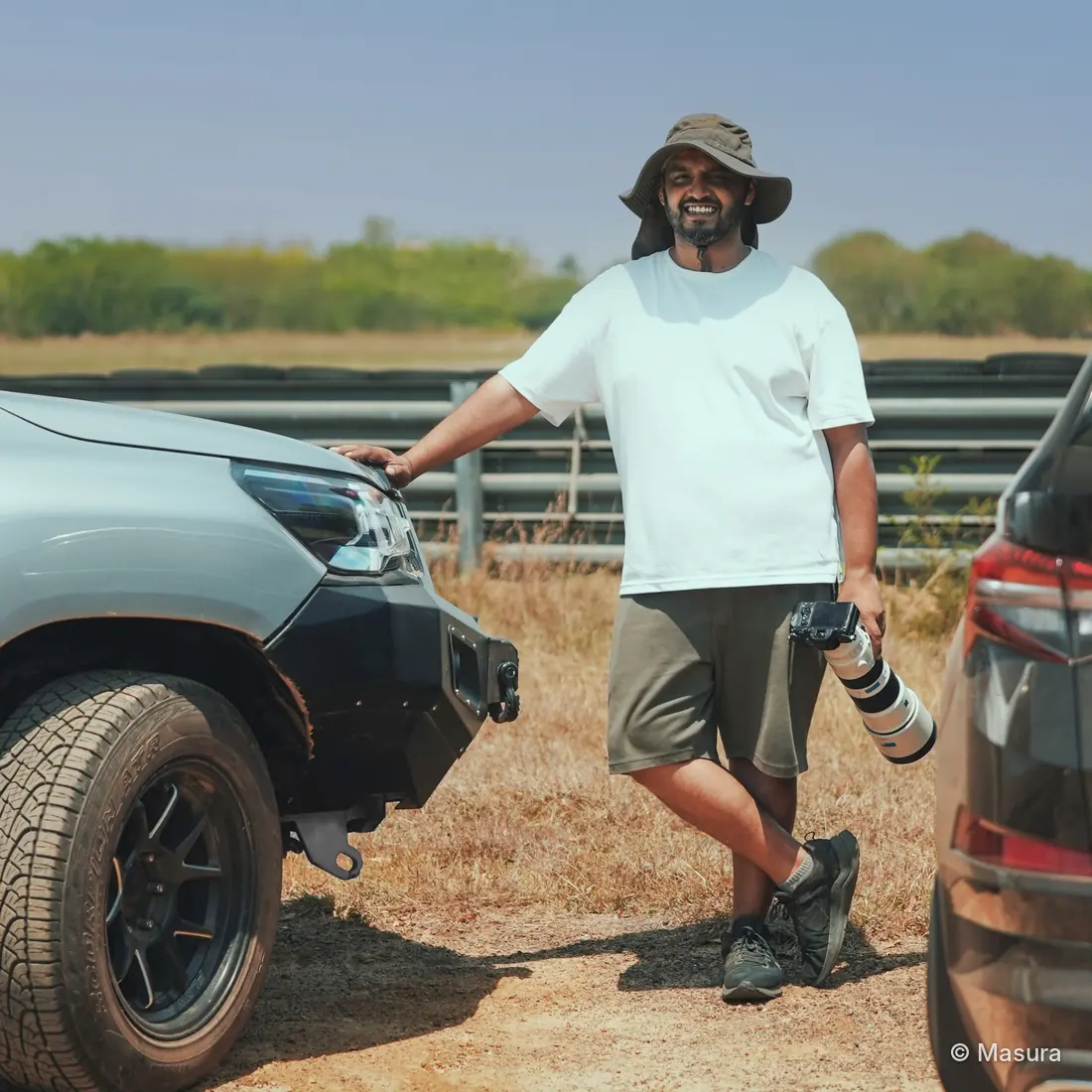 Pramukh Bajaj, founder of Masura, with a long lens at a racetrack